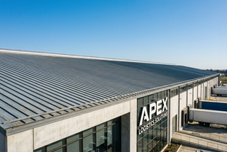 Commercial warehouse with standing seam metal roofing system installed by Top Tier Metals.